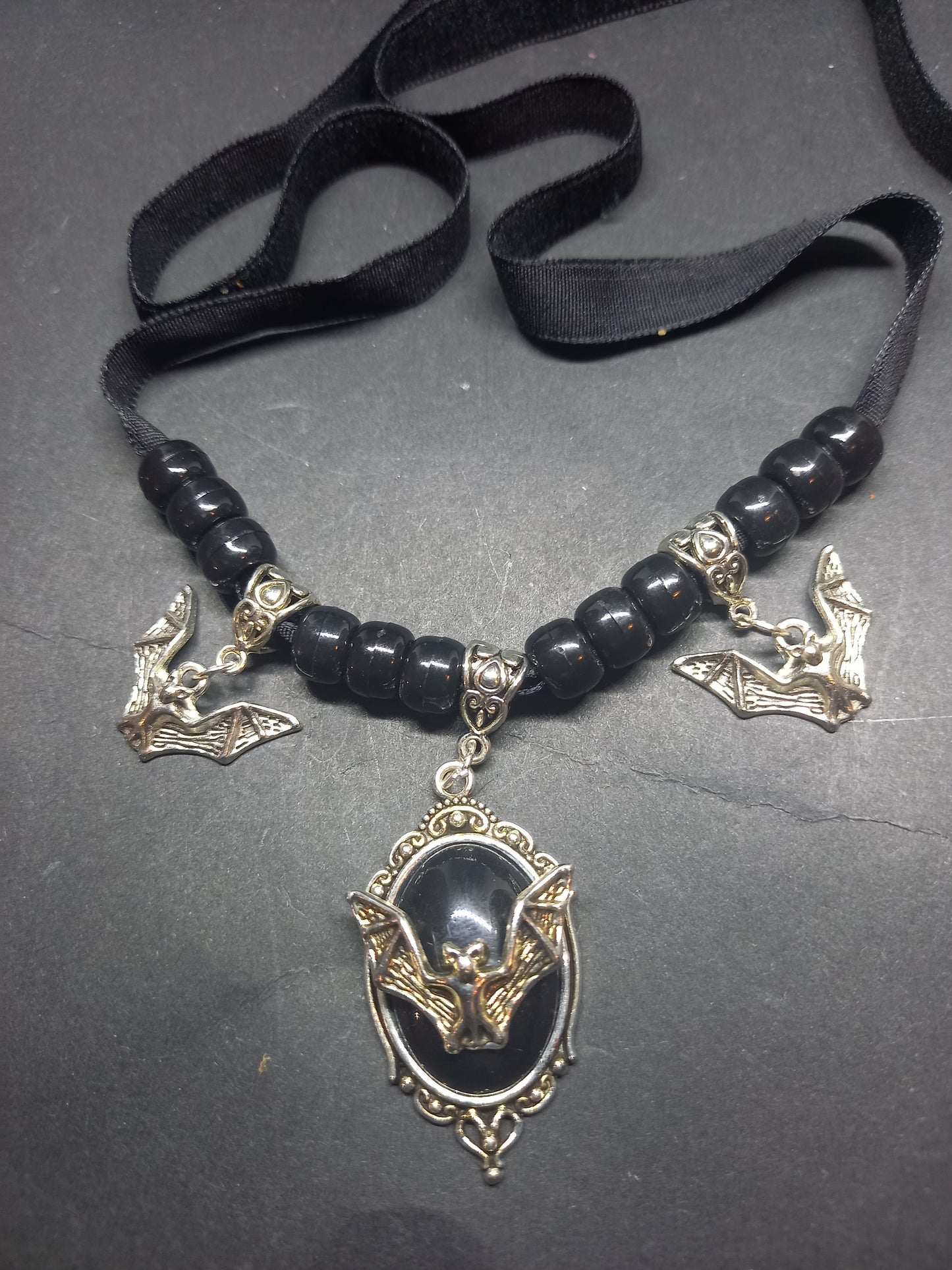 Goth Gothic Witchy vampire "Ornate open wing bat with matching bat charms and skull beads"on Black velvet Ribbon Choker