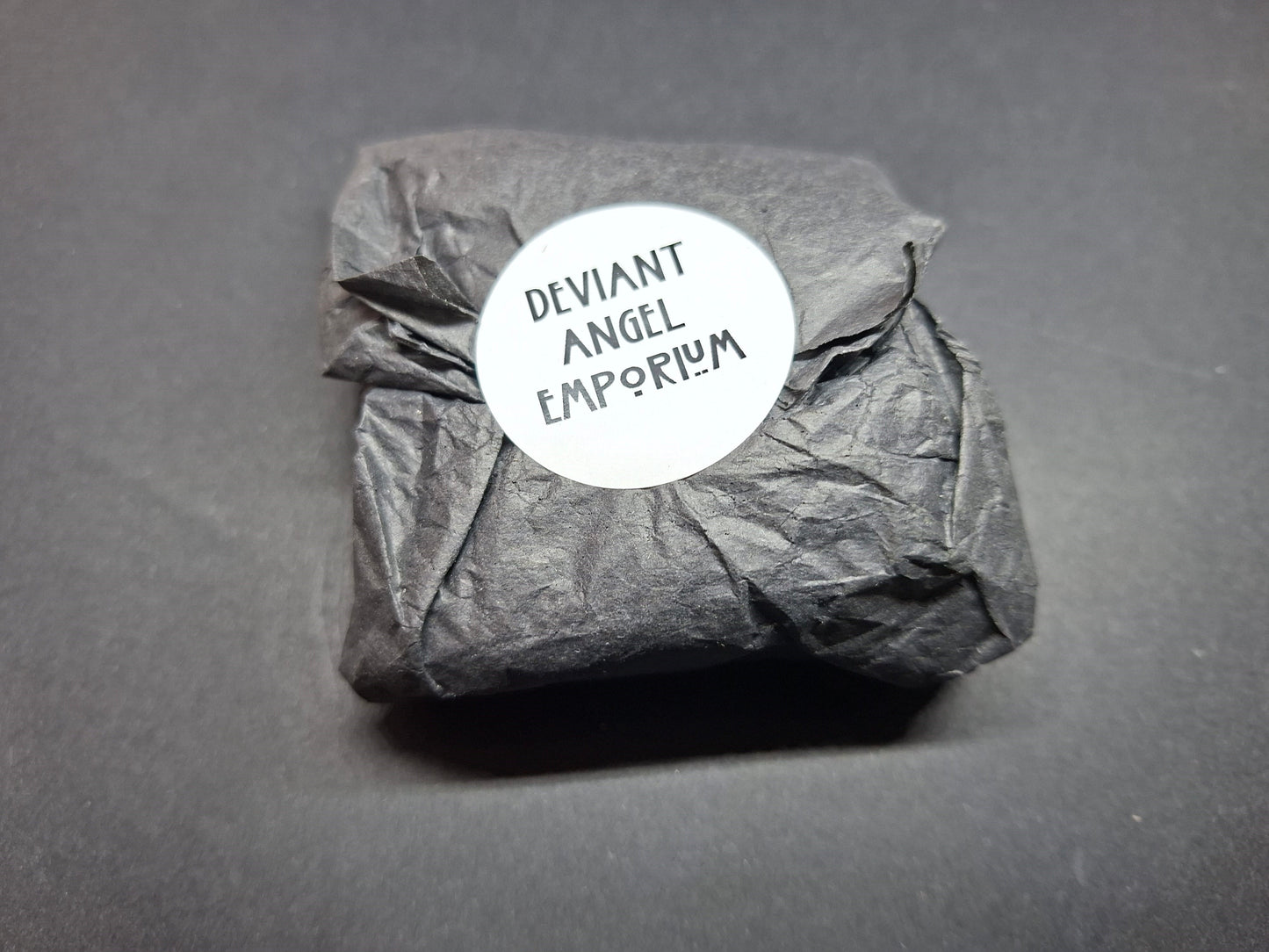 Inverted metal crucifix pin badge with satanic sigils