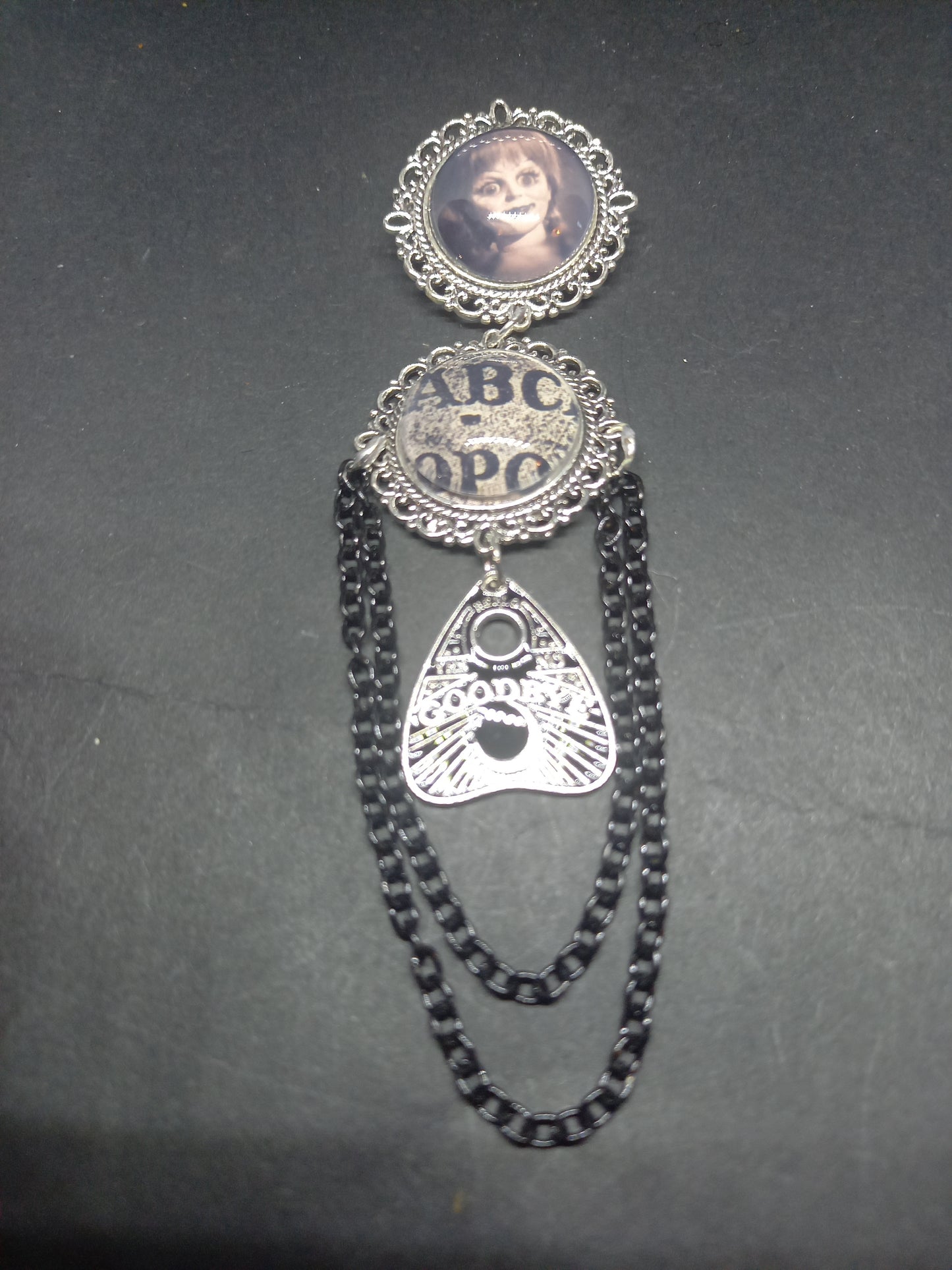 Oddity curiosity  gothic  witchy  Killstar occult " Annabelle inspired double image Ornate Brooch "with spirit board and ouija planchette & chains