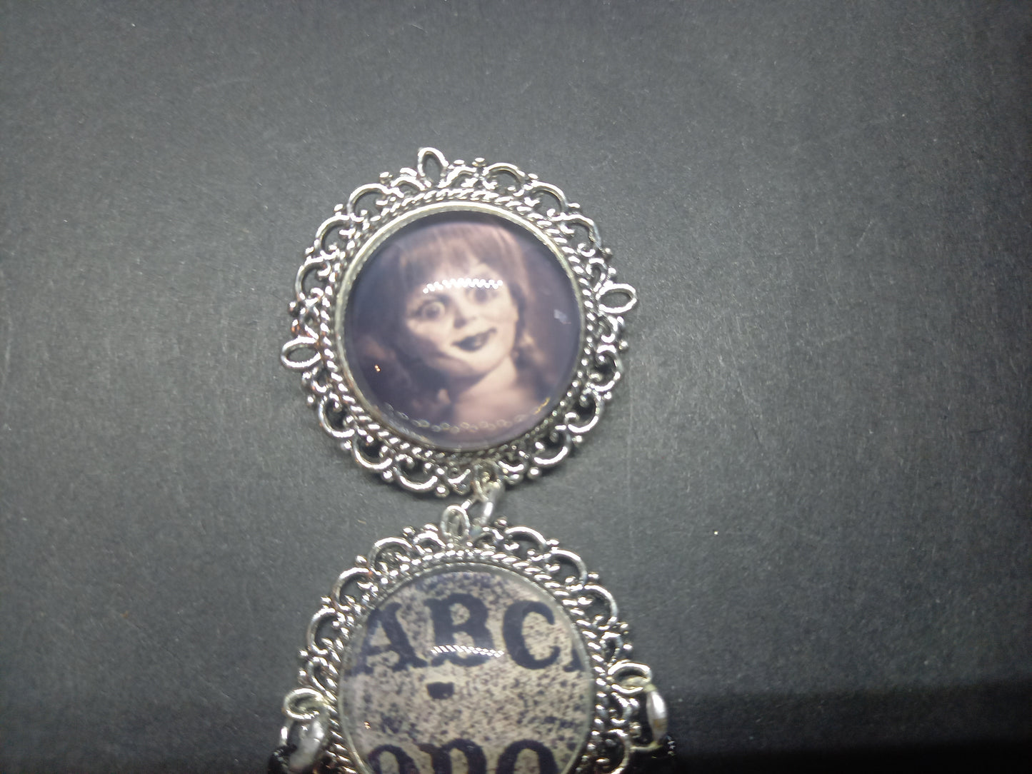 Oddity curiosity  gothic  witchy  Killstar occult " Annabelle inspired double image Ornate Brooch "with spirit board and ouija planchette & chains