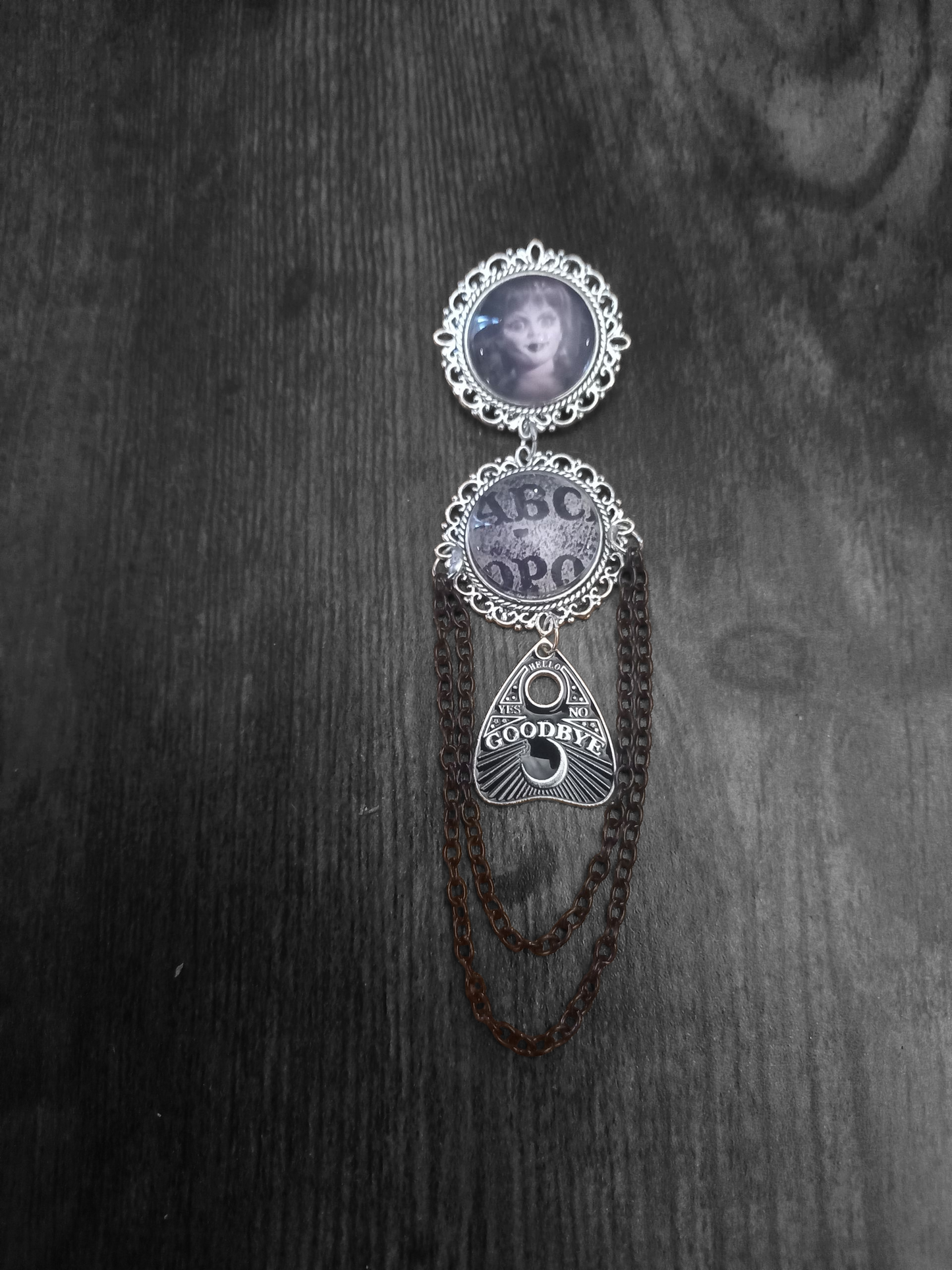 Oddity curiosity  gothic  witchy  Killstar occult " Annabelle inspired double image Ornate Brooch "with spirit board and ouija planchette & chains